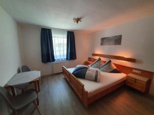 Posteľ alebo postele v izbe v ubytovaní Haus Bergheimat