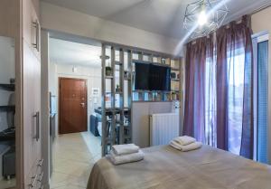 Posteľ alebo postele v izbe v ubytovaní Nora's Home Kalamata