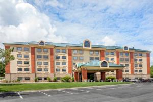 a large building with a parking lot in front of it at Holiday Inn Express Branson- Green Mountain Drive by IHG in Branson