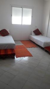 Ένα ή περισσότερα κρεβάτια σε δωμάτιο στο Costal Appart