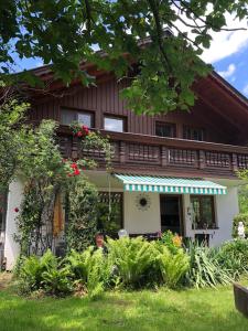 a house with a garden in front of it at Haus Belli in Bad Aussee