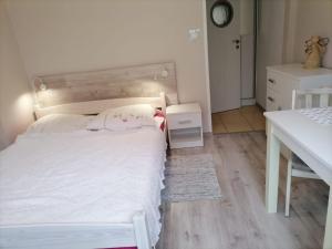 Postel nebo postele na pokoji v ubytování Pod Aniołami