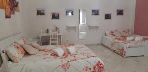 A bed or beds in a room at L'Opera dei Pupi B&b