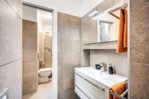 a bathroom with a sink and a toilet at Novembre 152 Apartment in Rome