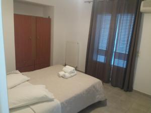 Postel nebo postele na pokoji v ubytování Harbour View - Oceanis Apartments