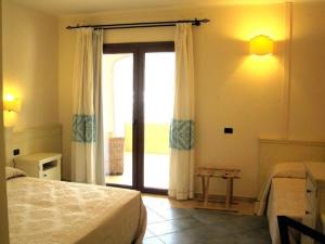 Postel nebo postele na pokoji v ubytování Hotel Baja Romantica