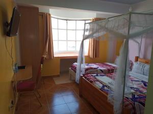 Ένα ή περισσότερα κρεβάτια σε δωμάτιο στο Tourgate Hotel