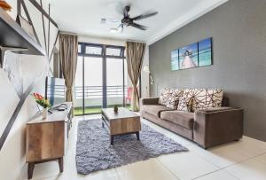 a living room with a couch and a table at 1 Tebrau Residences By JK Home in Johor Bahru