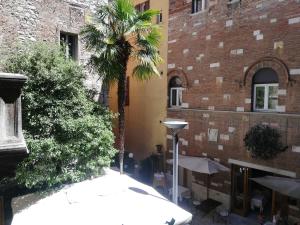 a large brick building with a large window at Hotel La Rosetta in Perugia
