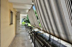 an empty balcony of a building with benches at Central Holiday Home Sperlonga in Sperlonga