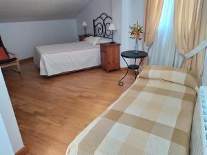 Postel nebo postele na pokoji v ubytování Vivienda Majaceite