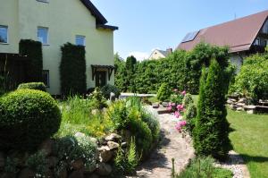 a garden in front of a house at Oaza U Tadeusza in Augustów