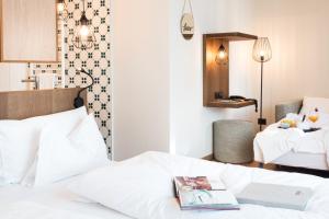 Voodi või voodid majutusasutuse Hotel Tofana toas