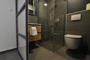 Vonios kambarys apgyvendinimo įstaigoje Mido Rooms