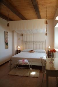 Säng eller sängar i ett rum på Agriturismo Al Crepuscolo