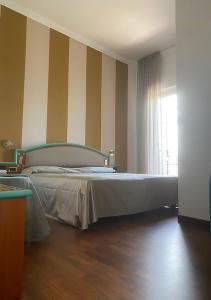 A bed or beds in a room at Hotel ristorante Bellavista Még 37 kép