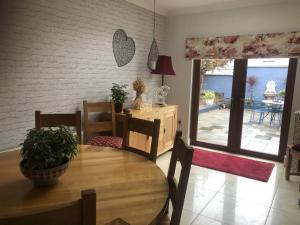 a dining room with a wooden table with chairs and a tableablish at Beechtree House in Dublin
