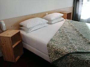 Postel nebo postele na pokoji v ubytování Hotel Calvaire