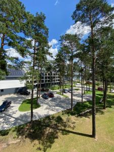 an overhead view of a parking lot with trees at Apartament Meralia in Augustów +28 photos