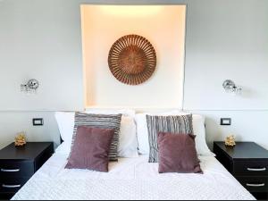 Кровать или кровати в номере Taonasi Mazzarò Apartments