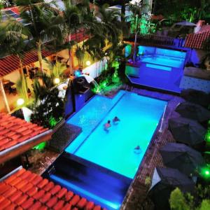 an overhead view of a swimming pool at night at Hotel Natural Brotas - SPA & Lazer in Brotas