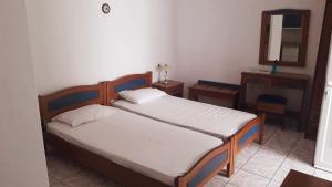 Theofilos Appartements客房内的一张或多张床位
