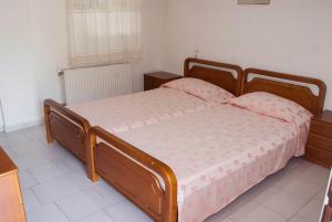 Postel nebo postele na pokoji v ubytování Ronzi Apartments