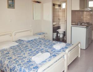 Postel nebo postele na pokoji v ubytování Ronzi Apartments