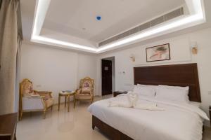 Postel nebo postele na pokoji v ubytování Alhattali Hotel + 33 fotografií