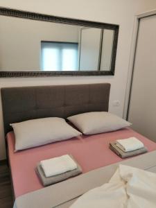 Ένα ή περισσότερα κρεβάτια σε δωμάτιο στο Apartment Ivan&Marko