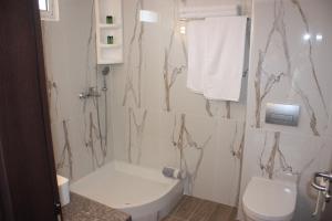 Kúpeľňa v ubytovaní Hotel Cariatis