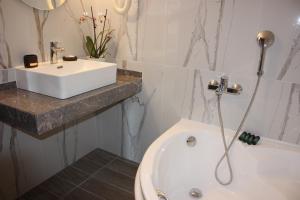 Kúpeľňa v ubytovaní Hotel Cariatis