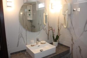 Kúpeľňa v ubytovaní Hotel Cariatis