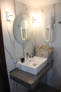 Kúpeľňa v ubytovaní Hotel Cariatis