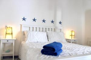 Postel nebo postele na pokoji v ubytování BLU MARE suite privata & apartment
