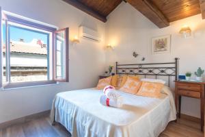 En eller flere senge i et værelse på Mini Loft scorcio di mare