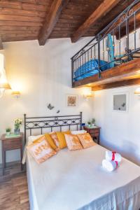 En eller flere senge i et værelse på Mini Loft scorcio di mare