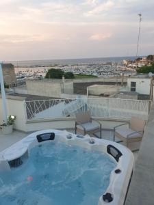 a hot tub on the roof of a building at Appartamenti porta mare in Otranto