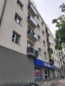 a large building with balconies on the side of it at Saulriets in Liepāja