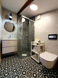 a bathroom with a shower and a toilet and a sink at Casa Isabella B&B in Koper