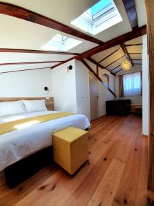 a bedroom with a large bed and skylights at Casa Isabella B&B in Koper