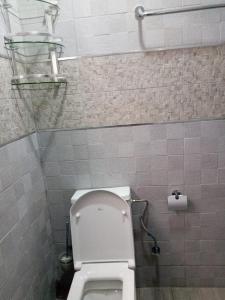 a bathroom with a white toilet in a stall at Al-marsa2 in Al Hoceïma