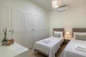 Posteľ alebo postele v izbe v ubytovaní Kite Blue Villas