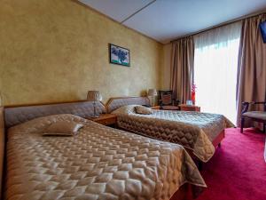 Postel nebo postele na pokoji v ubytování Hotel Belvedere + 37 fotografií