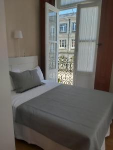 Łóżko lub łóżka w pokoju w obiekcie Pension La Corredera