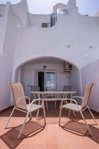 a room with two chairs and a table and a table at Vistamojacar in Mojácar