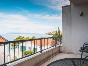 a balcony with a view of the ocean at Apartments Luketina in Tučepi