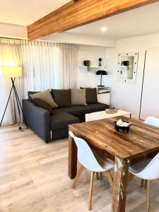 a living room with a couch and a table at Kingscliff Holiday Rental in Kingscliff