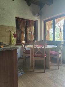 a kitchen with a table and chairs in a room at Chalet Chamois in Courmayeur