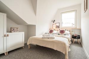 Posteľ alebo postele v izbe v ubytovaní Apartamenty Smrekowa Turnia